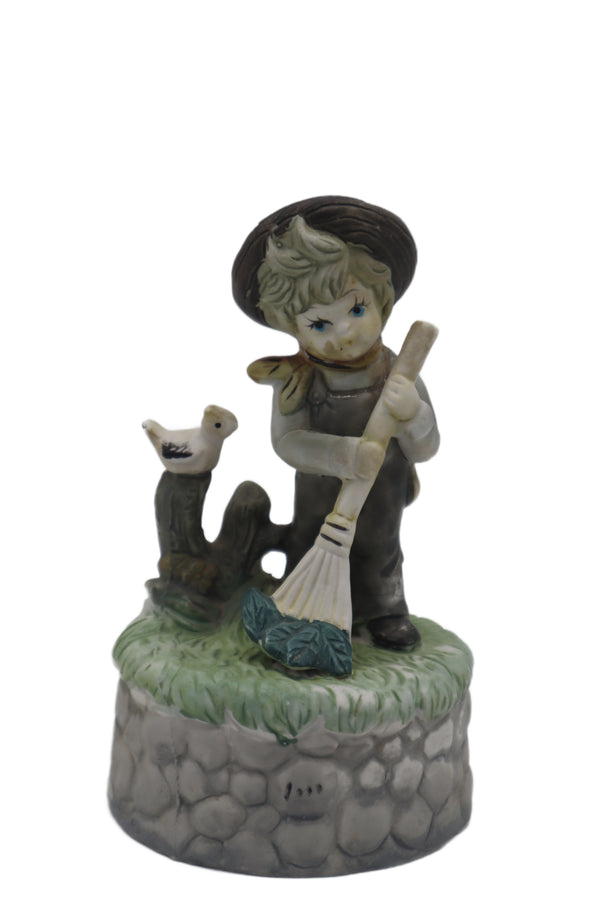 Boy with Duck and Broom